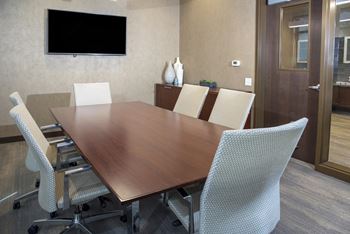Private conference room available to residents. Complete with a table to seat 6 people and a large TV.